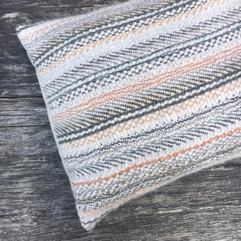 Handwoven cushion in eco wool
