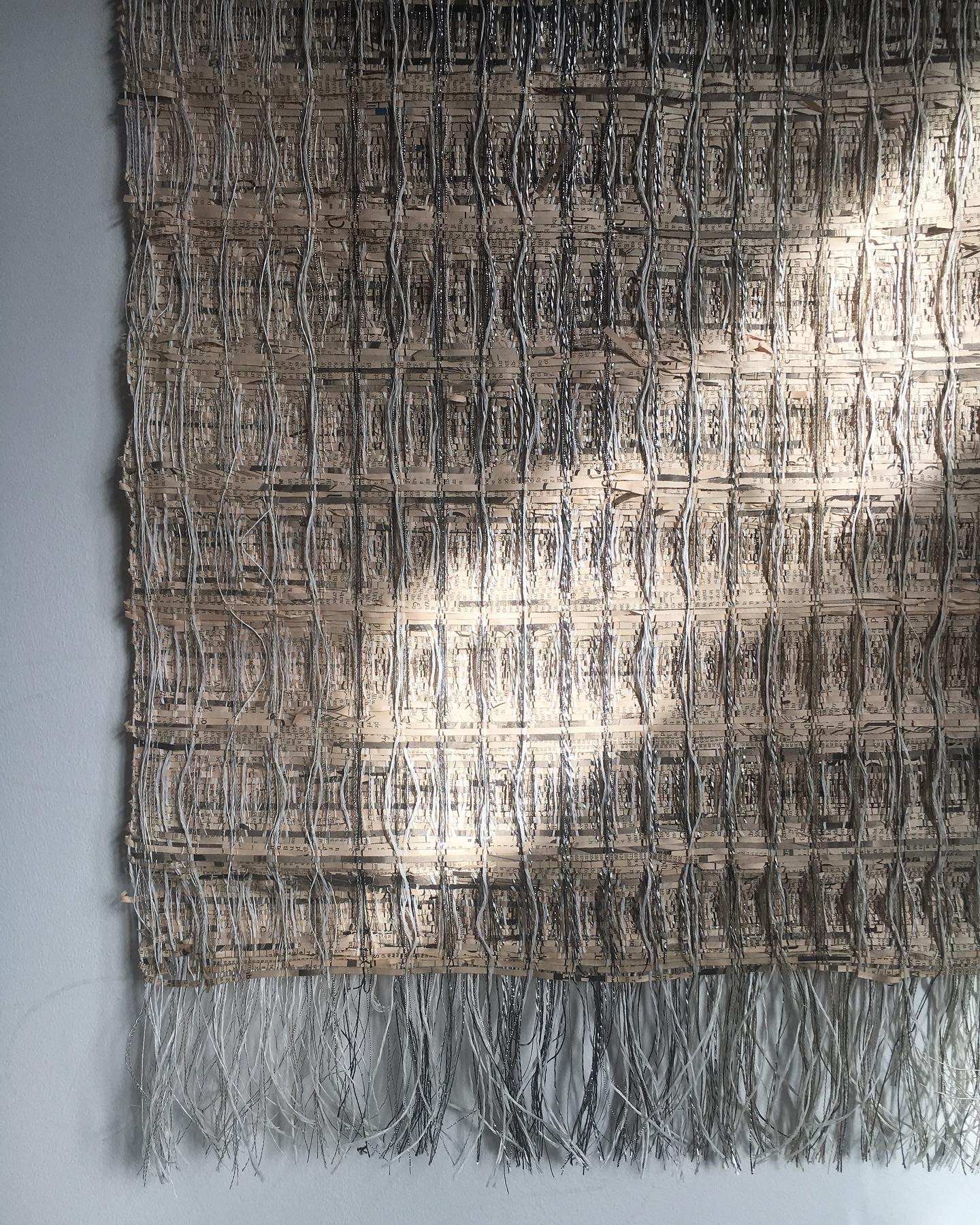 Handwoven newspaper wall art