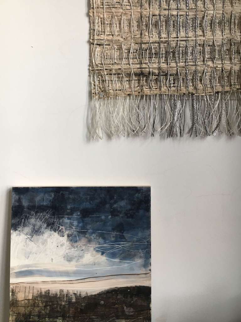 Handwoven wall hanging and mixed media on board
