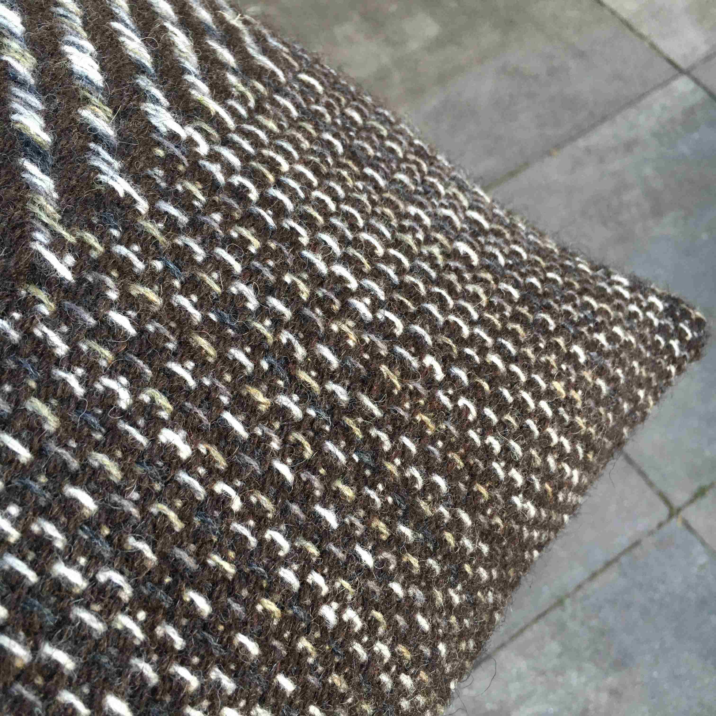 Wool cushion in umber