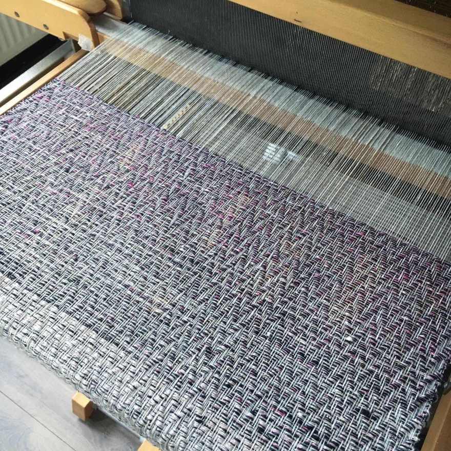 Linen warp in progress on loom
