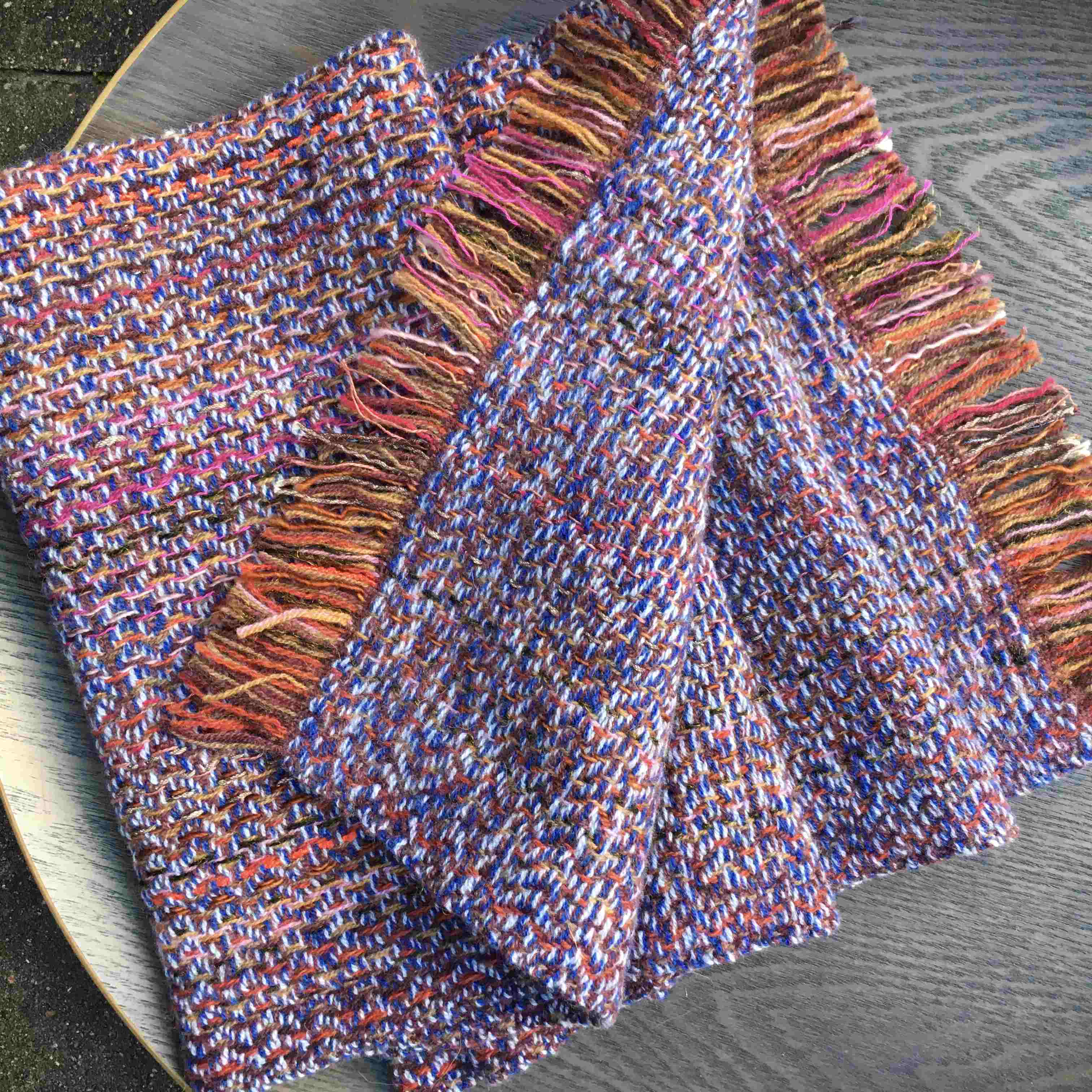 Warp in autumnal colours and weft in blue and brown