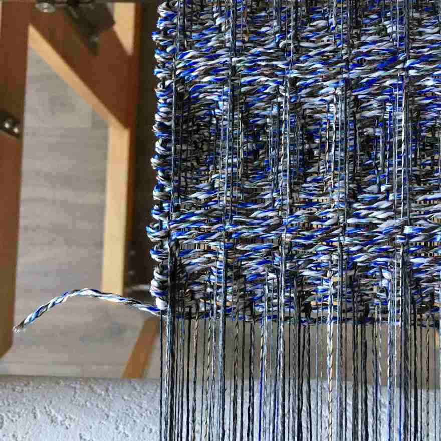 Recycled string weaving - detail on loom
