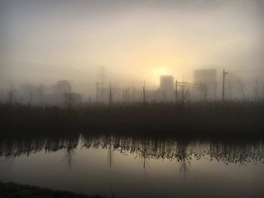 Sunrise over frosty canal