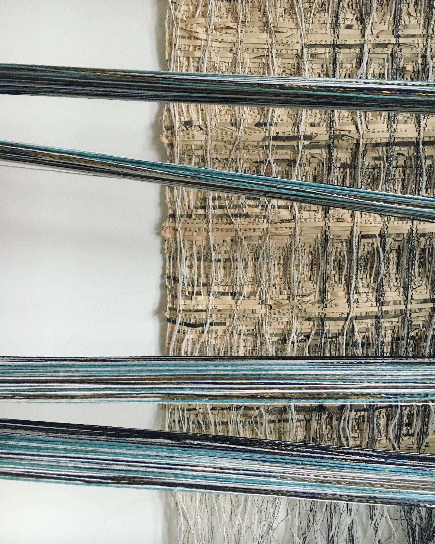 New warp with woven paper in background