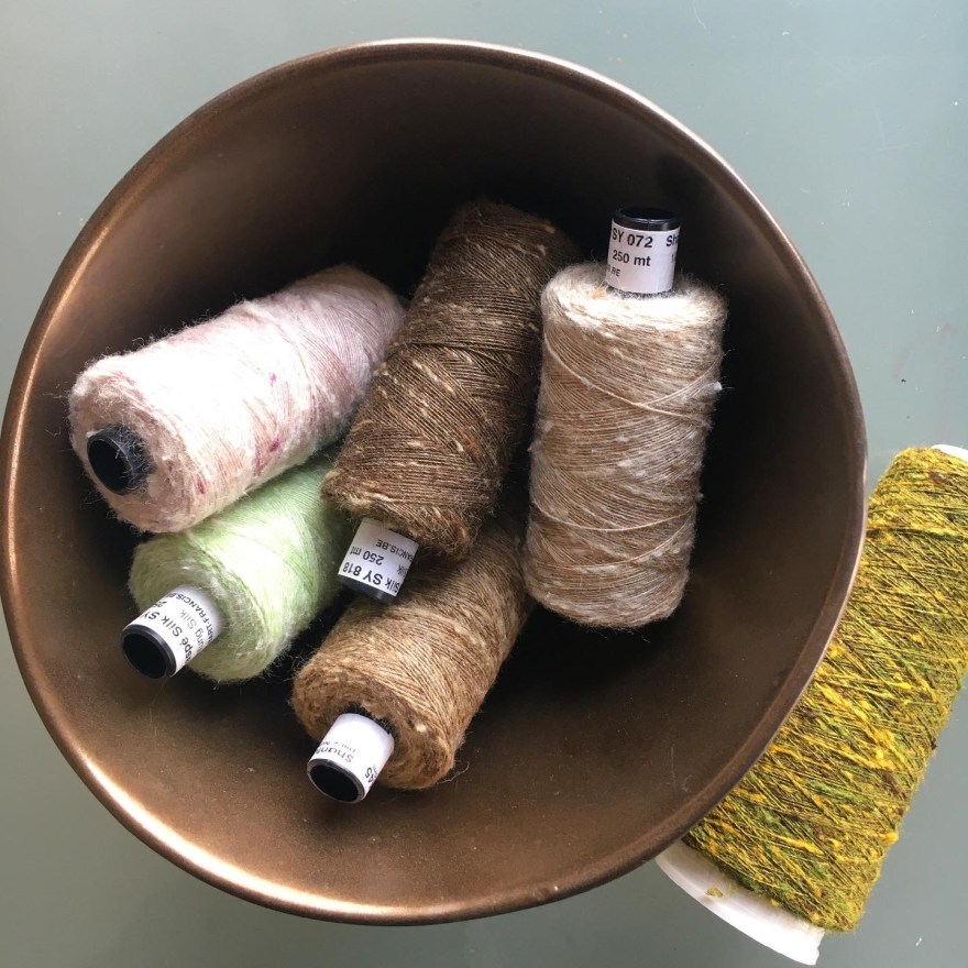 Silk yarns in ceramic bowl