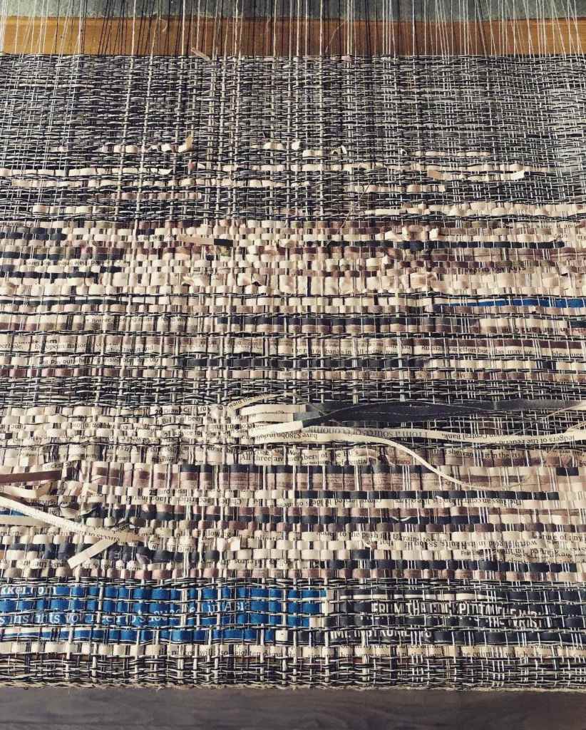 Woven newspaper with blue highlights