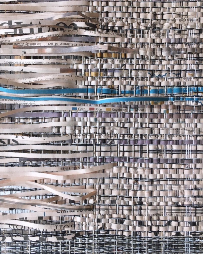 Woven newspaper with loose weft threads