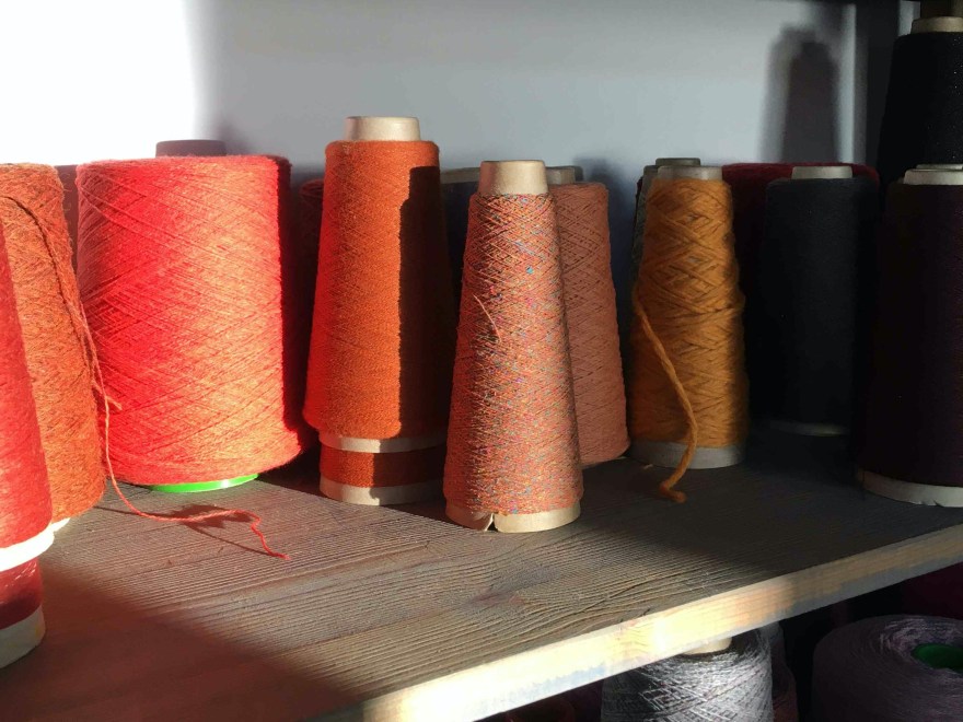Studio view November yarns on shelf in sunlight