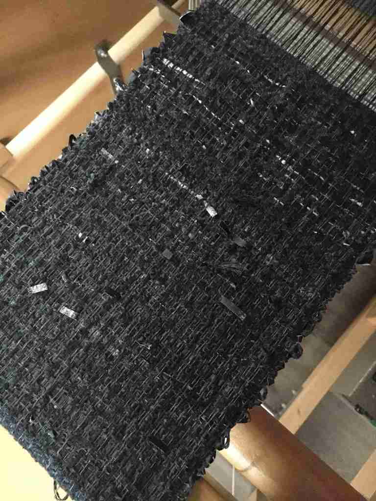 Black wabi sabi paper weave on loom