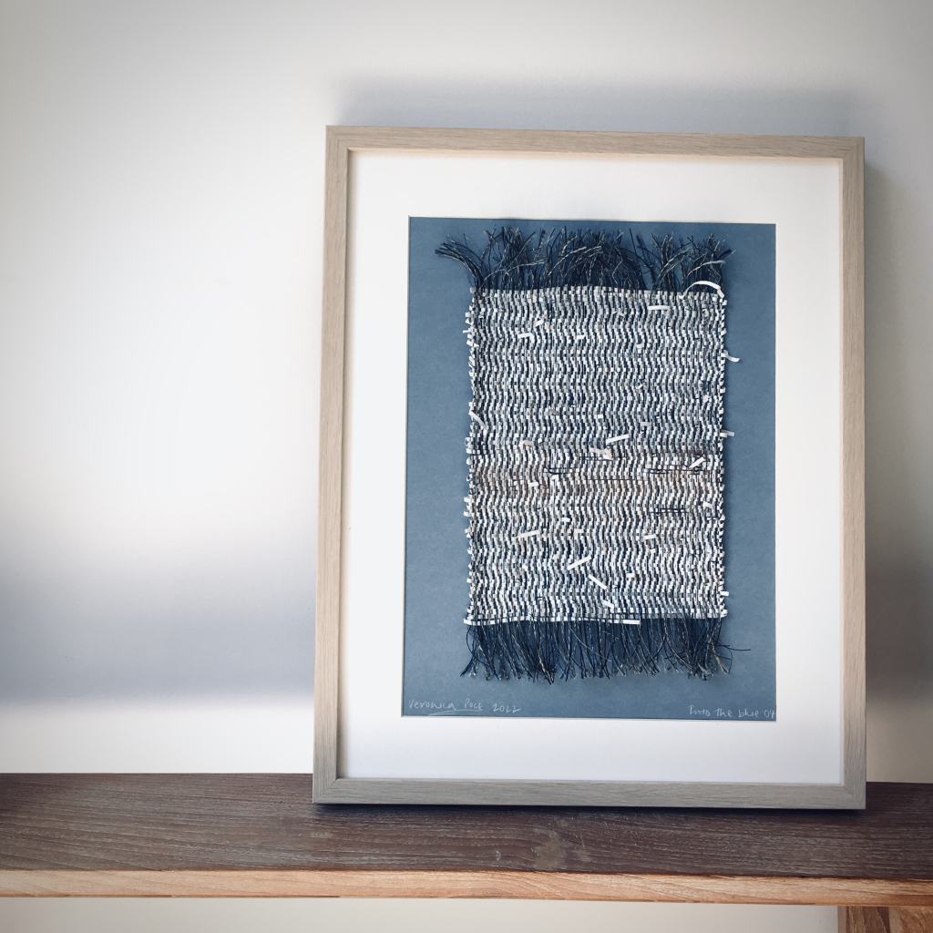 Woven framed piece in blue