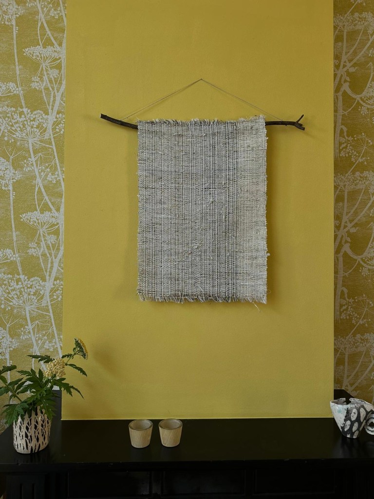 White Peak wallhanging in yellow room close up