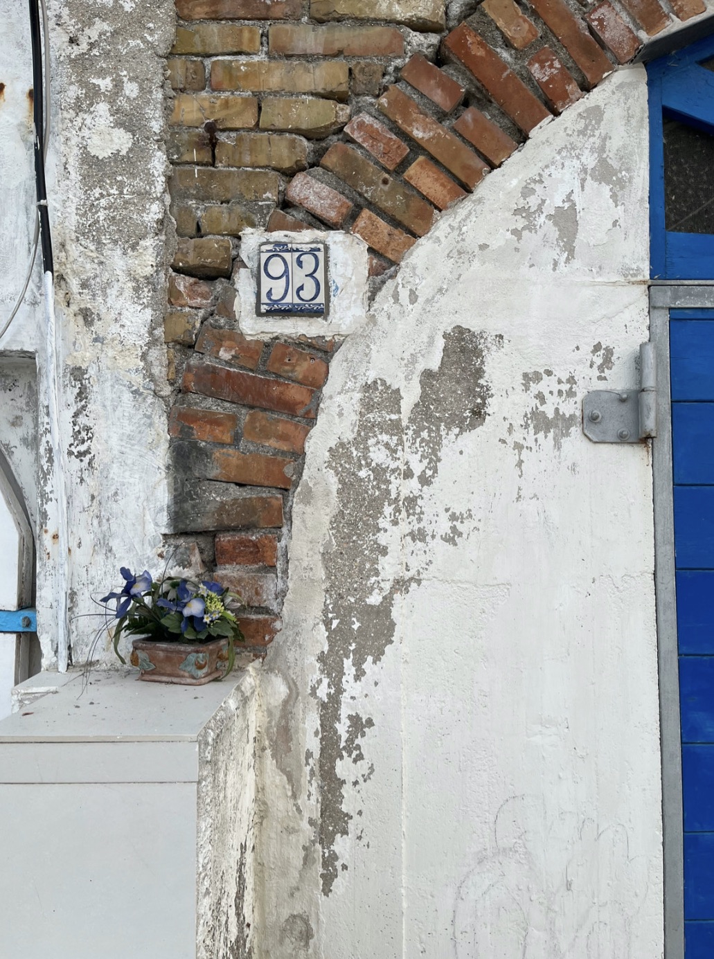 Beach cave door and wall at Spiaggia del Passetto, Ancona