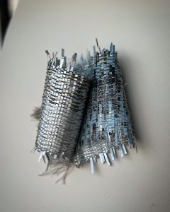 Sculptural textile on board