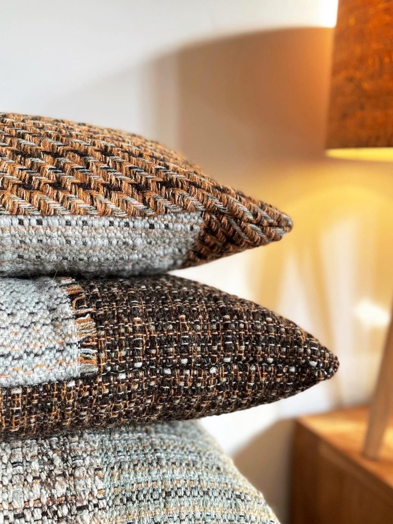 Handwoven lambswool cushions in earthy tones