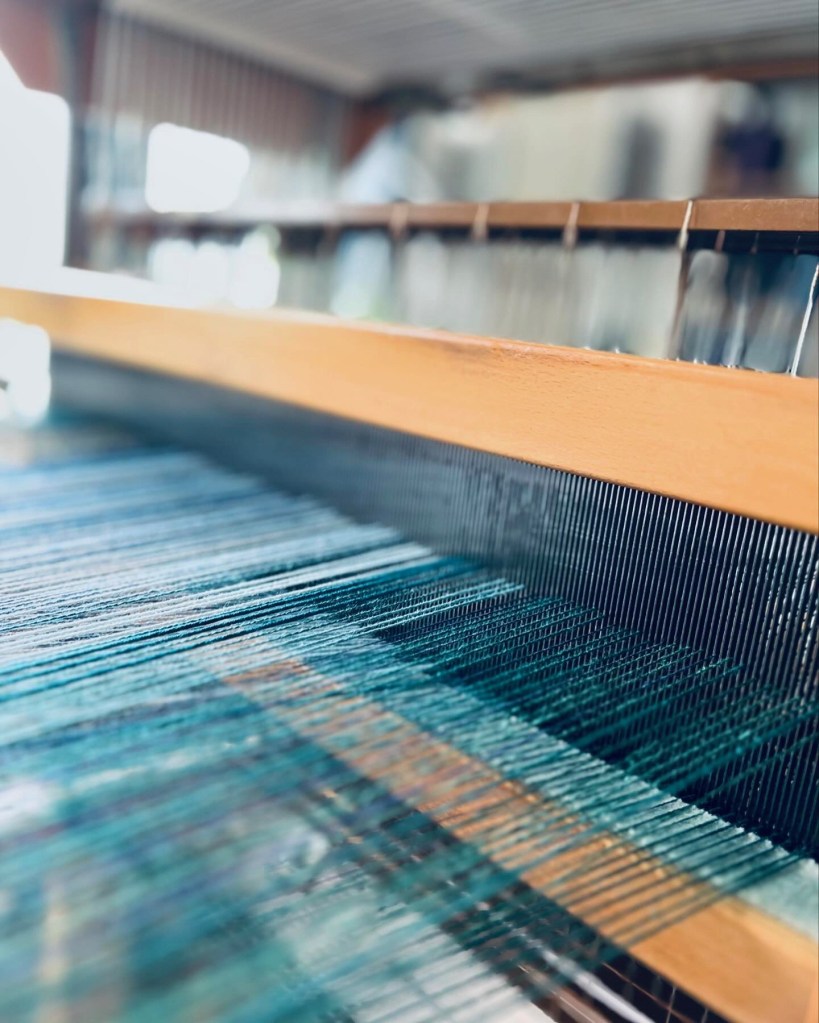 Threaded reed on loom