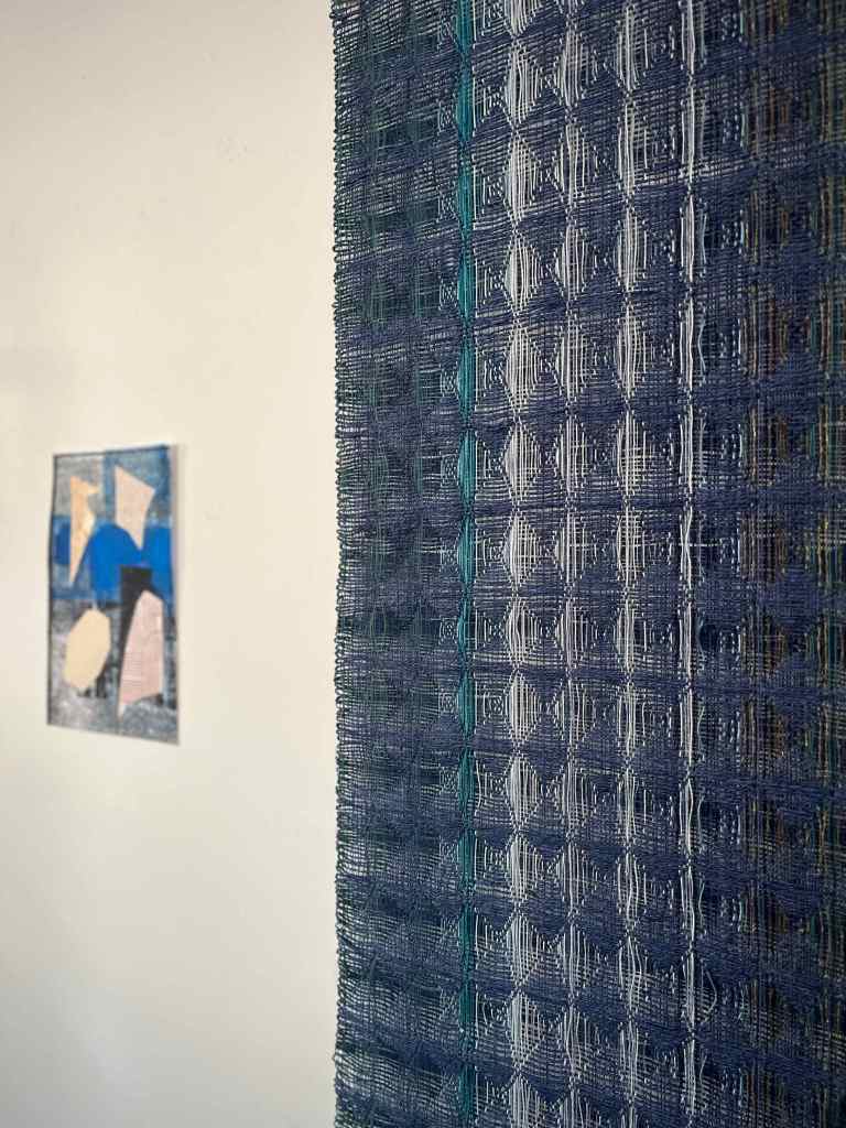 Blue honeycomb wall hanging and paper collage