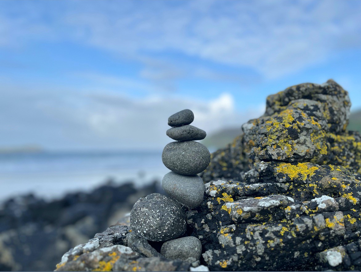 Making cairns on Calgary Bay