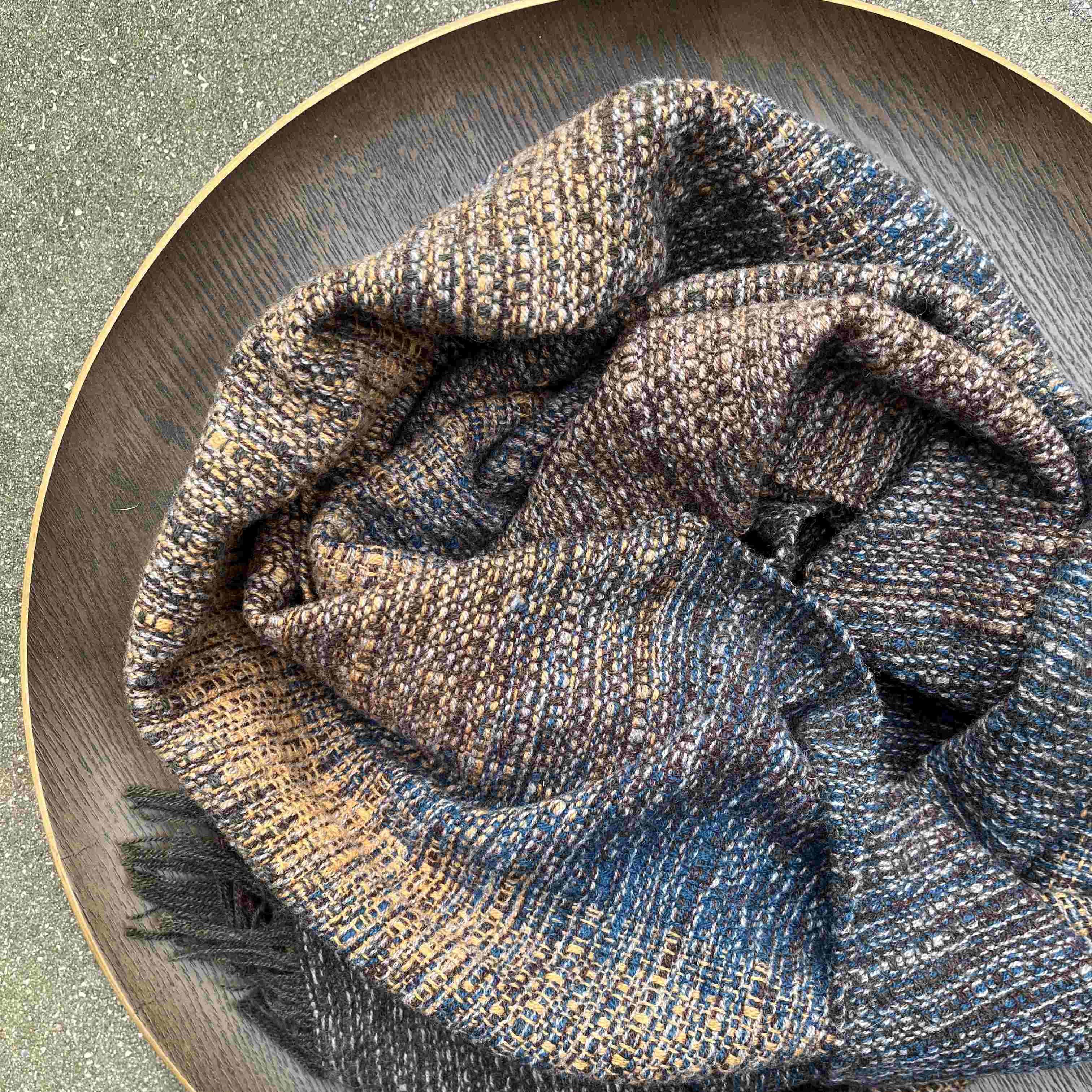 Handwoven lambswool scarf in blues, ochre and grey