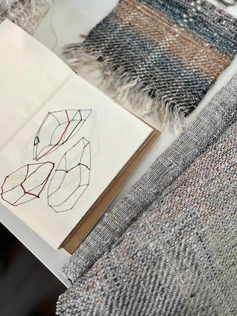 Sketchbook and samples on table